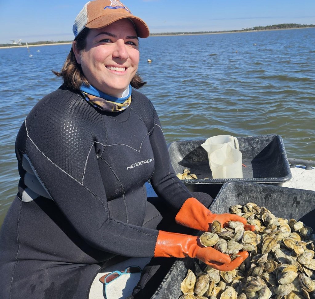woman holding oysters