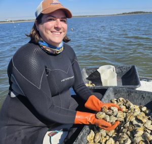 woman holding oysters